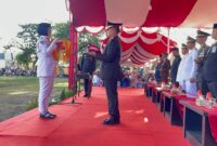 Kapolres Pidie Jaya, AKBP Ahmad Faisal Pasaribu, S.H., S.I.K., M.H., Inspektur Upacara di Lapangan Bola Kaki Kota Meureudu . Minggu 17-08-2025. Sore ( Foto.ist)